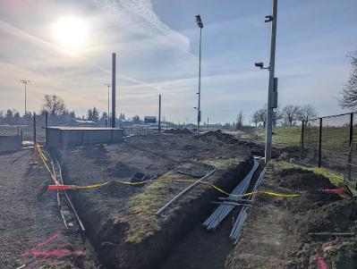 Installation of underground electrical piping around the baseball field to improve the field's lighting system.